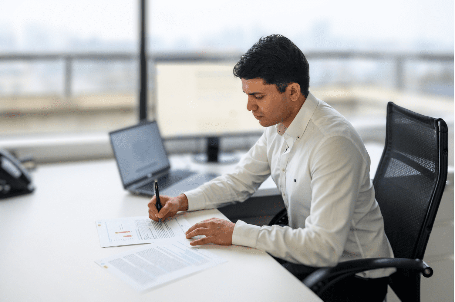 Man at desk writing