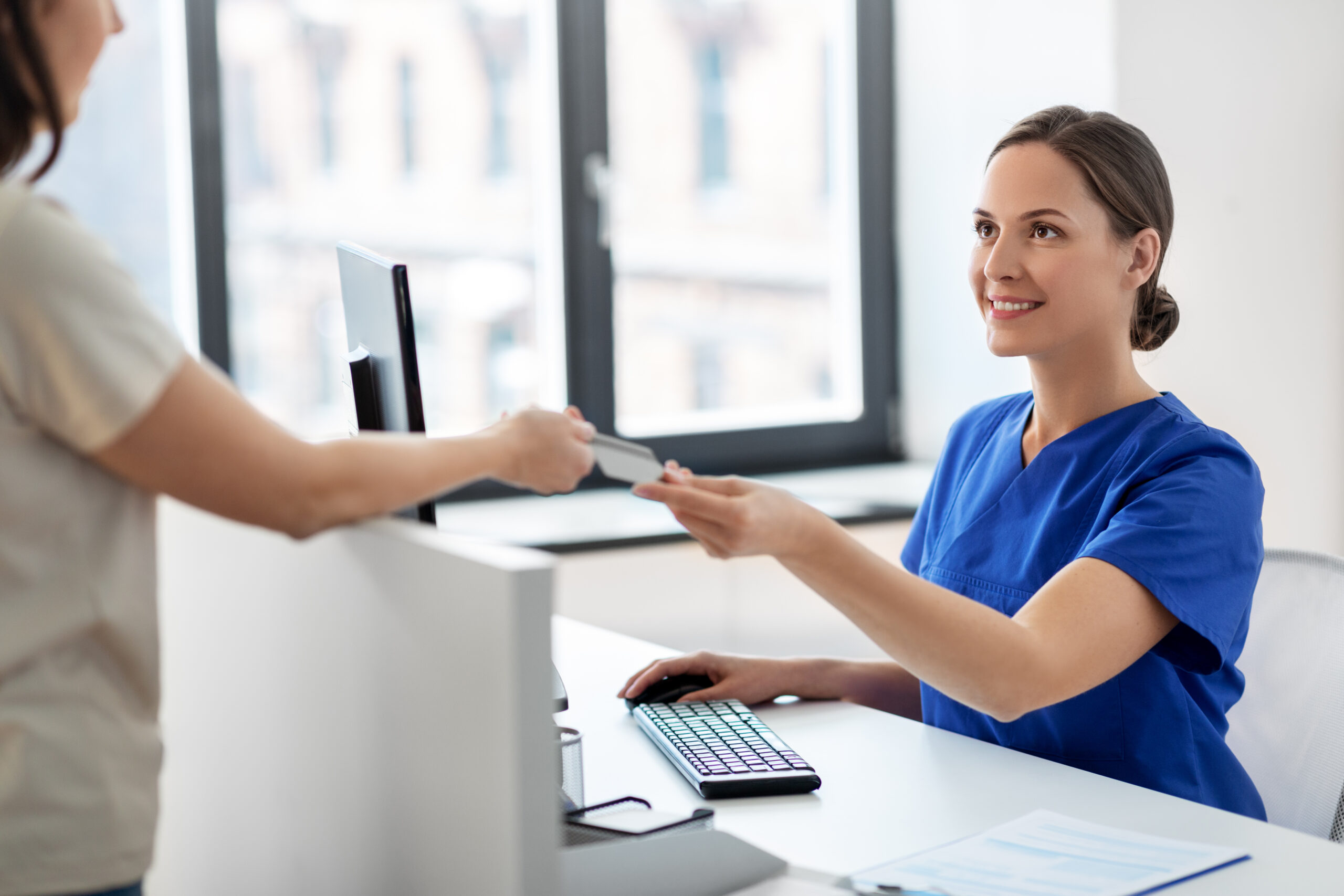 Health worker accepting ID card