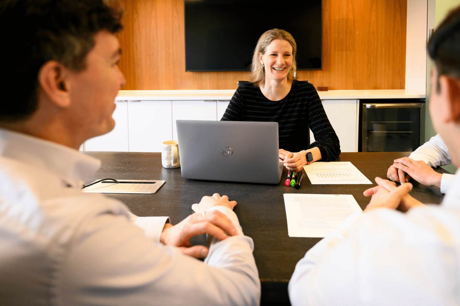 Woman at office table laughing