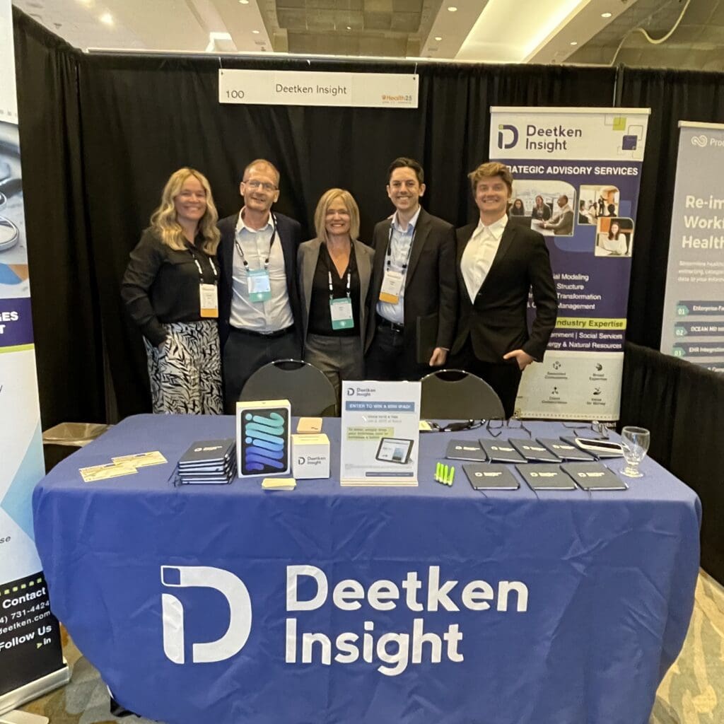 Photo of Deetken colleagues at conference booth