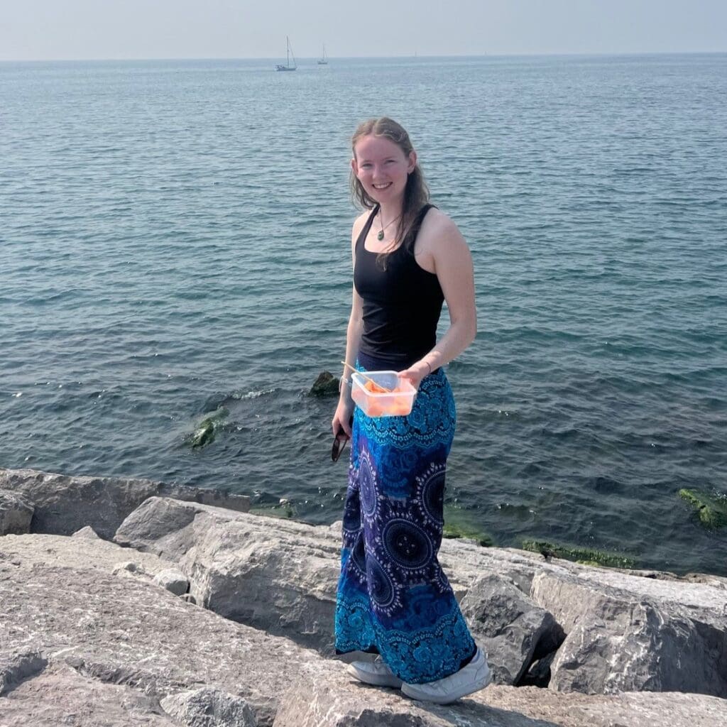 Photo of Alexandra Knight on rocks